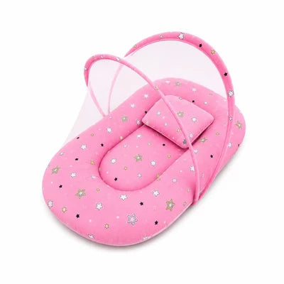 Baby mosquito net bed with matching pillow in pink star print