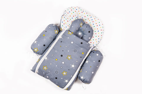 Soft padded grey baby sleeping bag carry nest unzipped flat in star print pattern