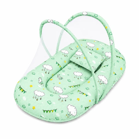 Baby mosquito net bed with matching pillow in soft green cloud print