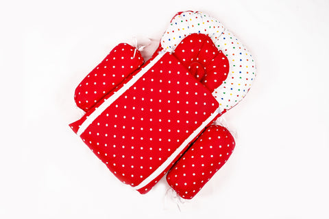 Soft padded red baby sleeping bag carry nest unzipped flat in polka dot print pattern