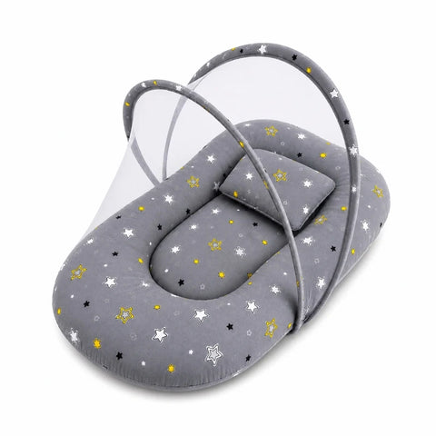 Baby mosquito net bed with matching pillow in neutral grey star print