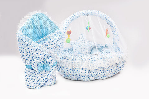 Soft baby snuggle bed with protective net and hanging rattle toys in blue flower print