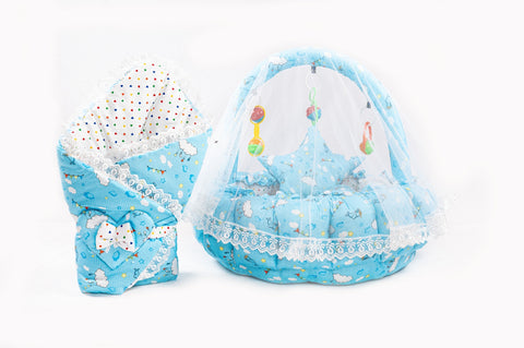 Soft baby snuggle bed with protective net and hanging rattle toys in sky blue cloud print