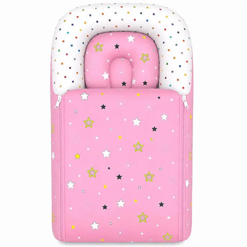 Cushioned pink baby carry nest with matching star print contoured pillow