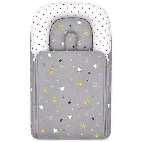 Cushioned grey baby carry nest with matching star print contoured pillow