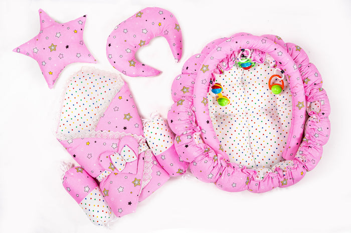 Complete 10 piece baby snuggle bed set with mosquito net in pink star print