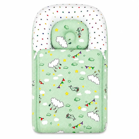 Soft cushioned green baby carry nest with matching cloud print contoured pillow