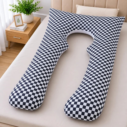 U shaped pregnancy body pillow in black and white check print on bed