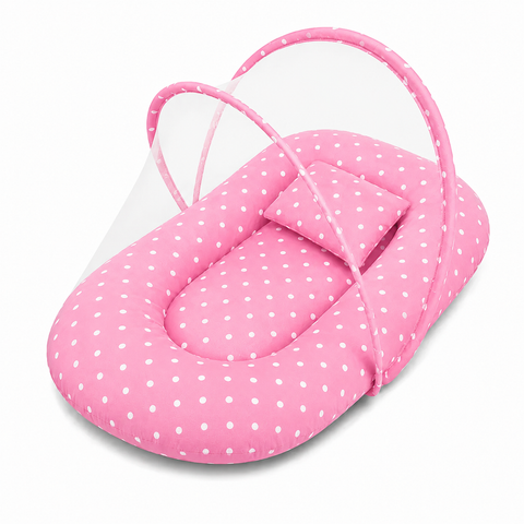 Baby mosquito net bed with matching pillow in pink polka dot print